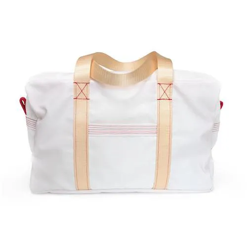 A photo of a white ranger bag with red stiching and a cream strap.